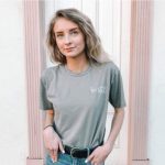 A girl wearing the premium unisex t-shirt, which is the most popular t-shirt style.